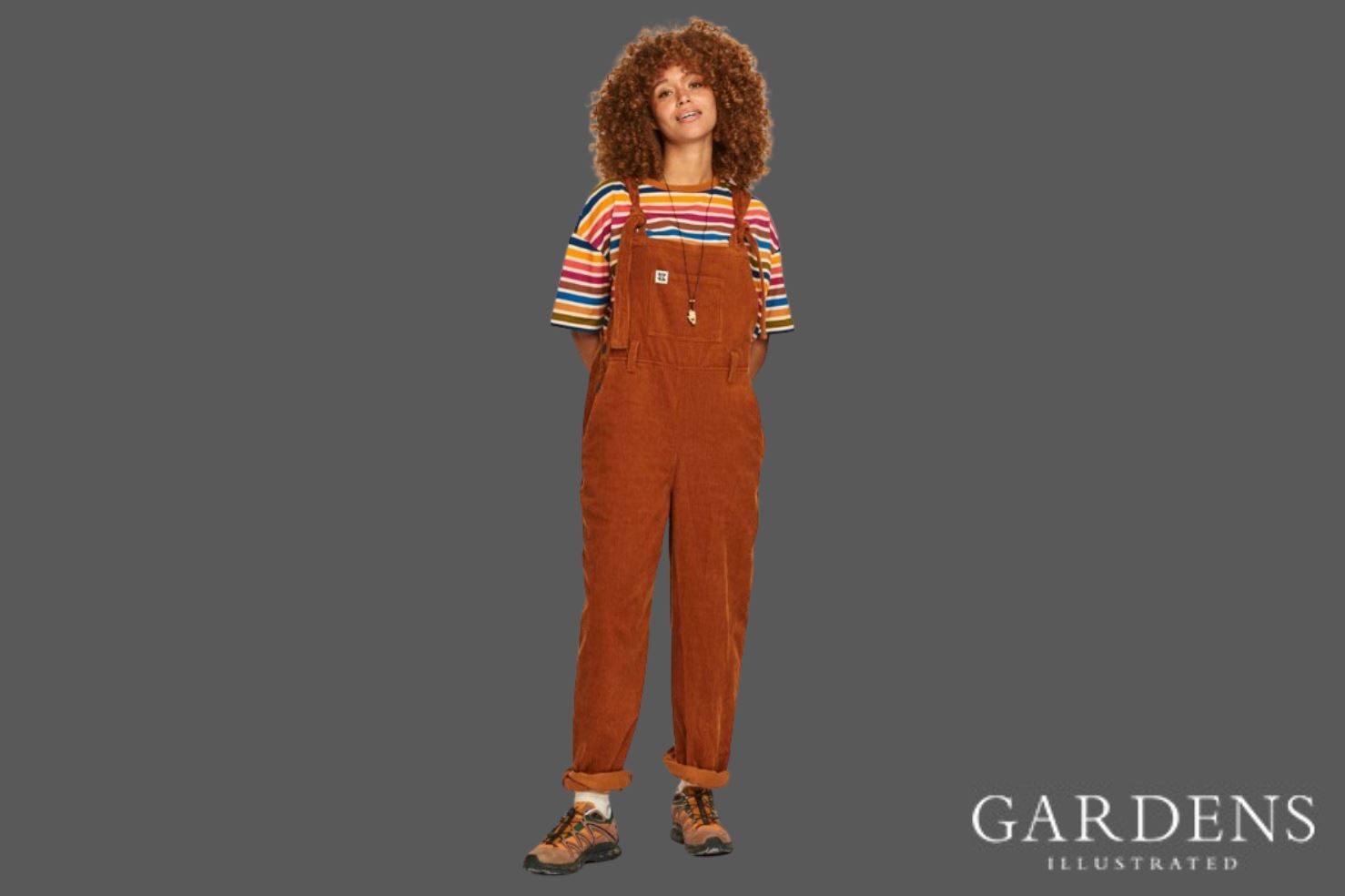 Lucy & Yak Easton Corduroy Dungaree in Caramel on a grey background