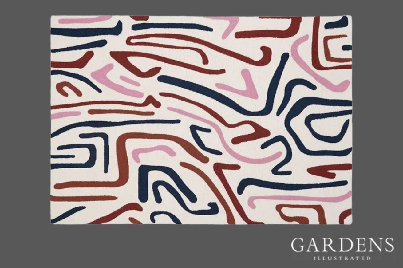 Harlequin Synchronic Orchid Outdoor Rug on a grey background