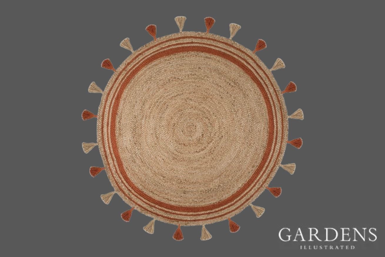 Round Jute Outdoor Rug on a grey background