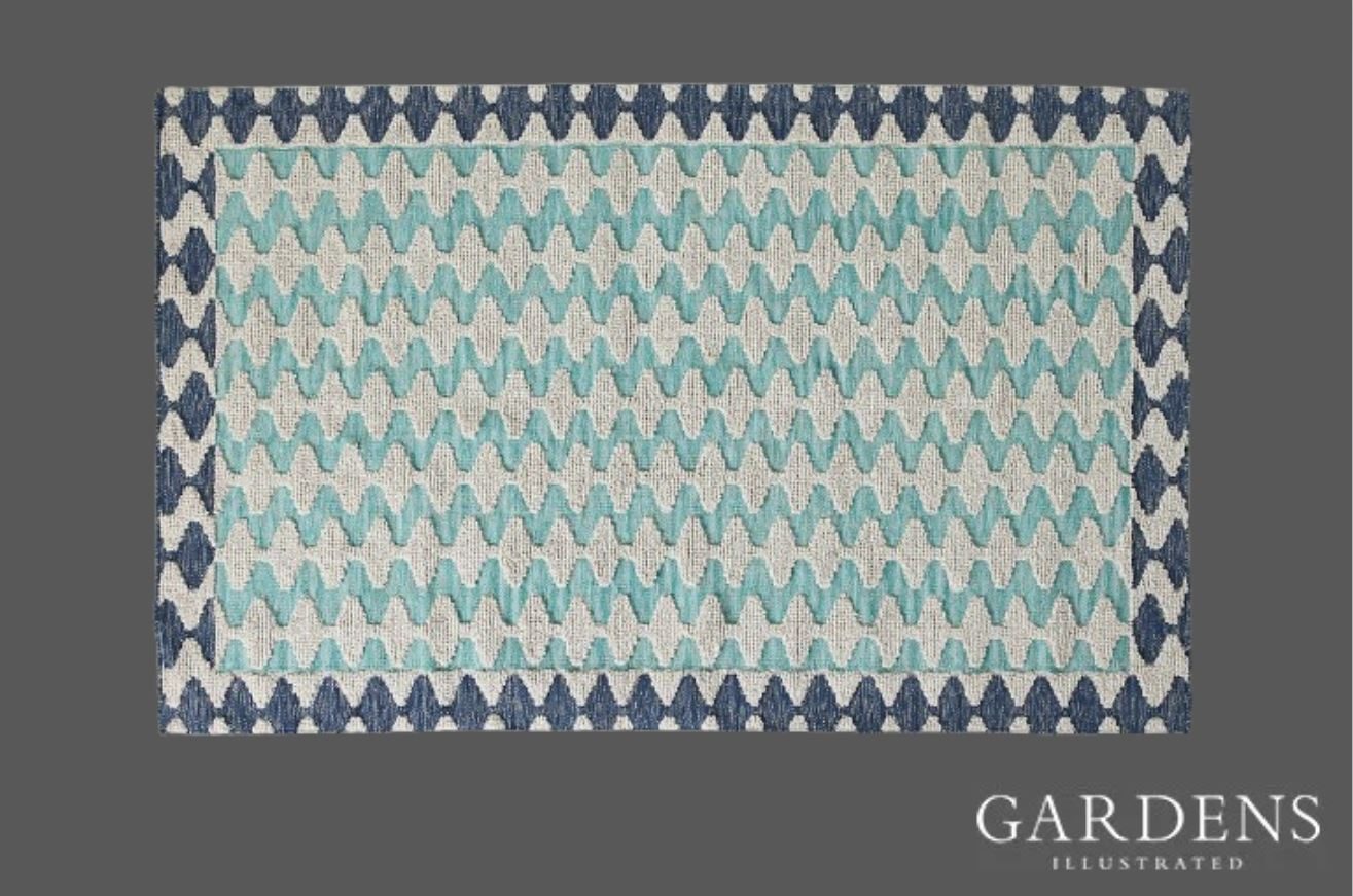 Handwoven Akna Indoor/Outdoor Rug on a grey background