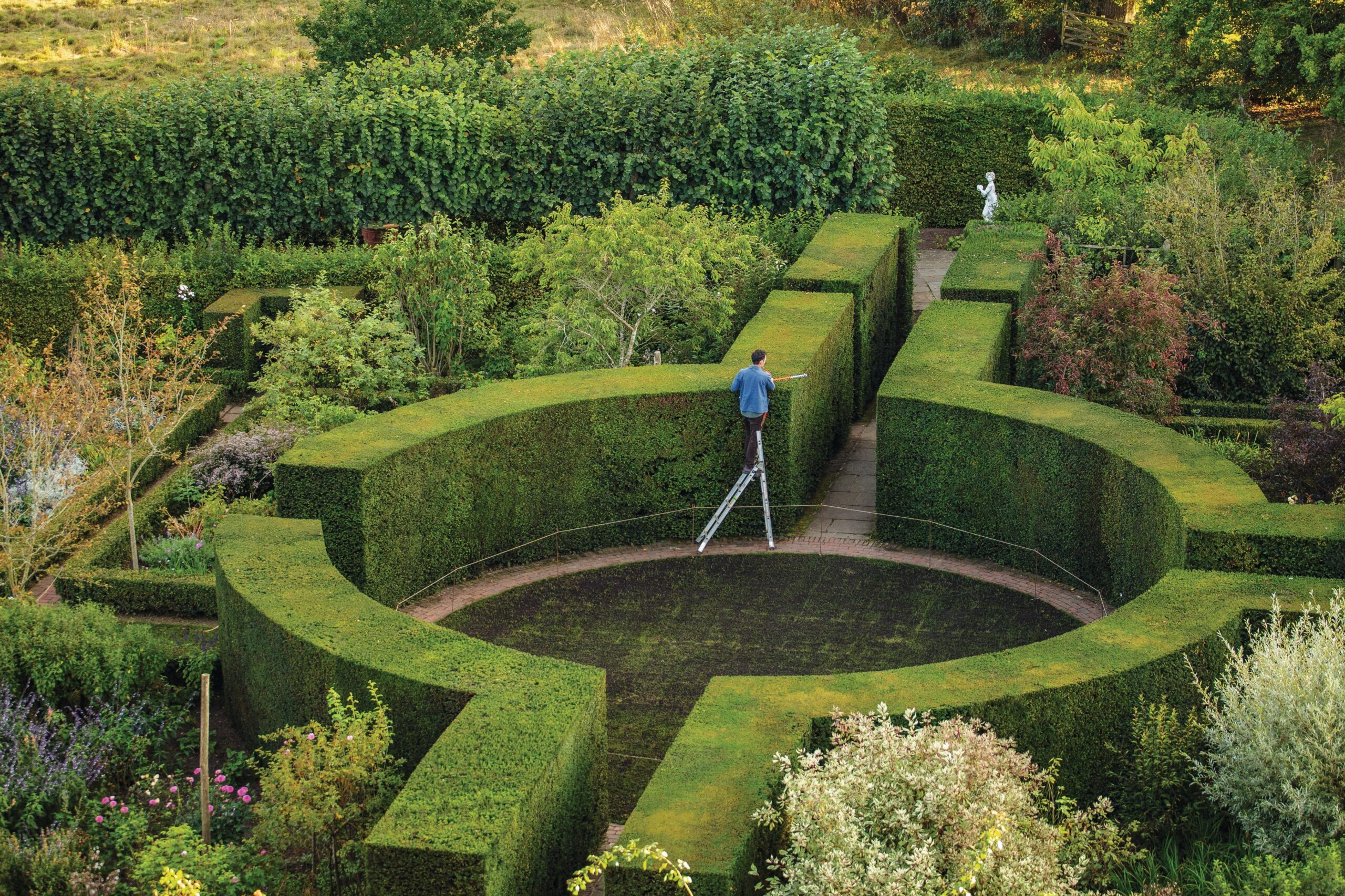 Hedge cutting the Rondel at Sissinghirst Castle Garden