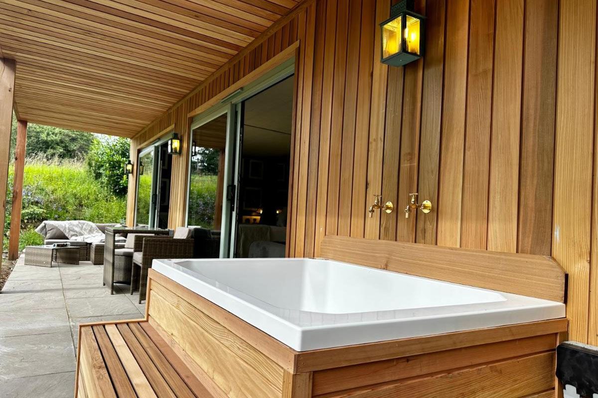 An outdoor bath on a terrace at Woodcutters Cabin, Peak District