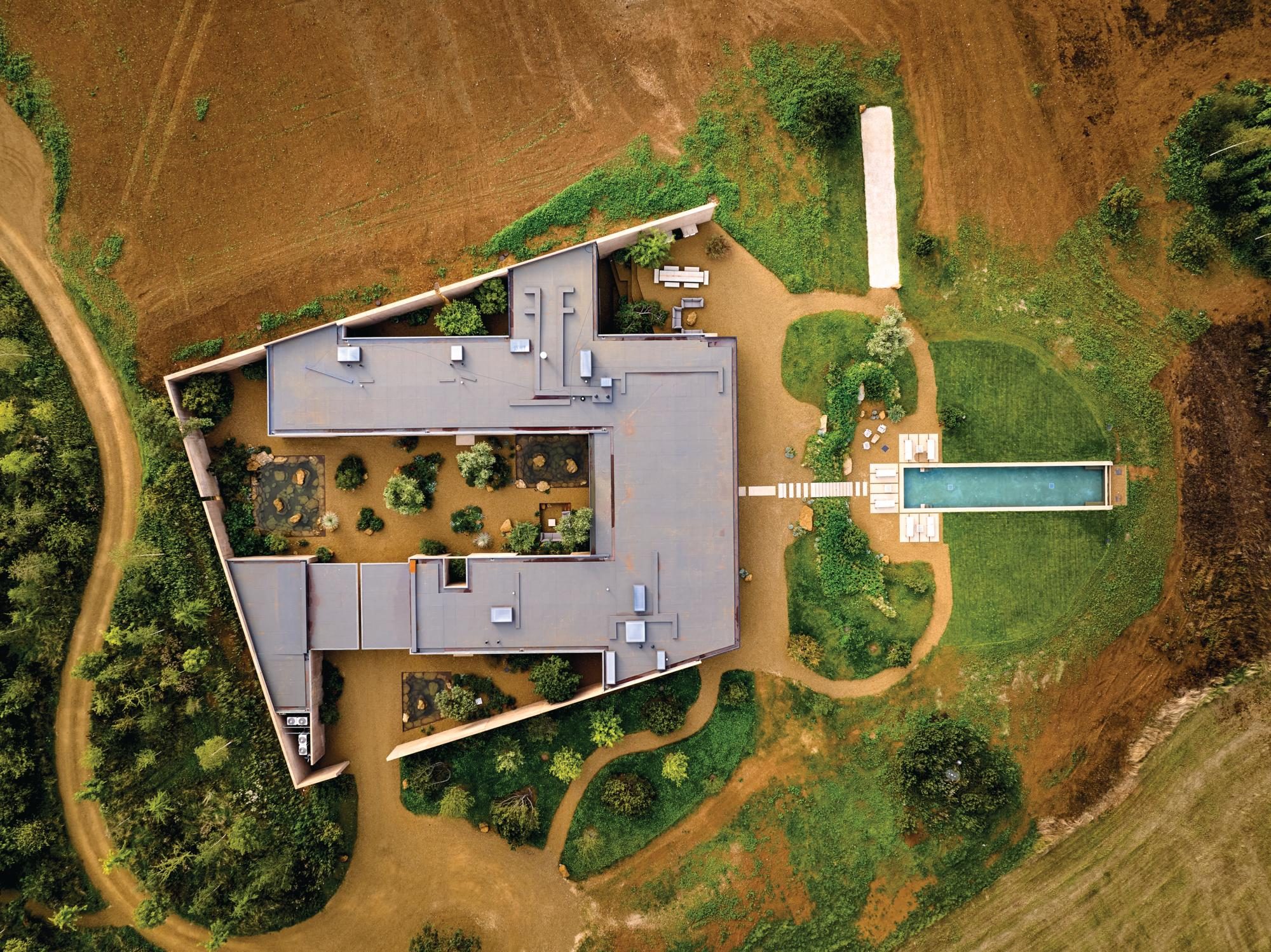 A house from overhead with swimming pool and garden