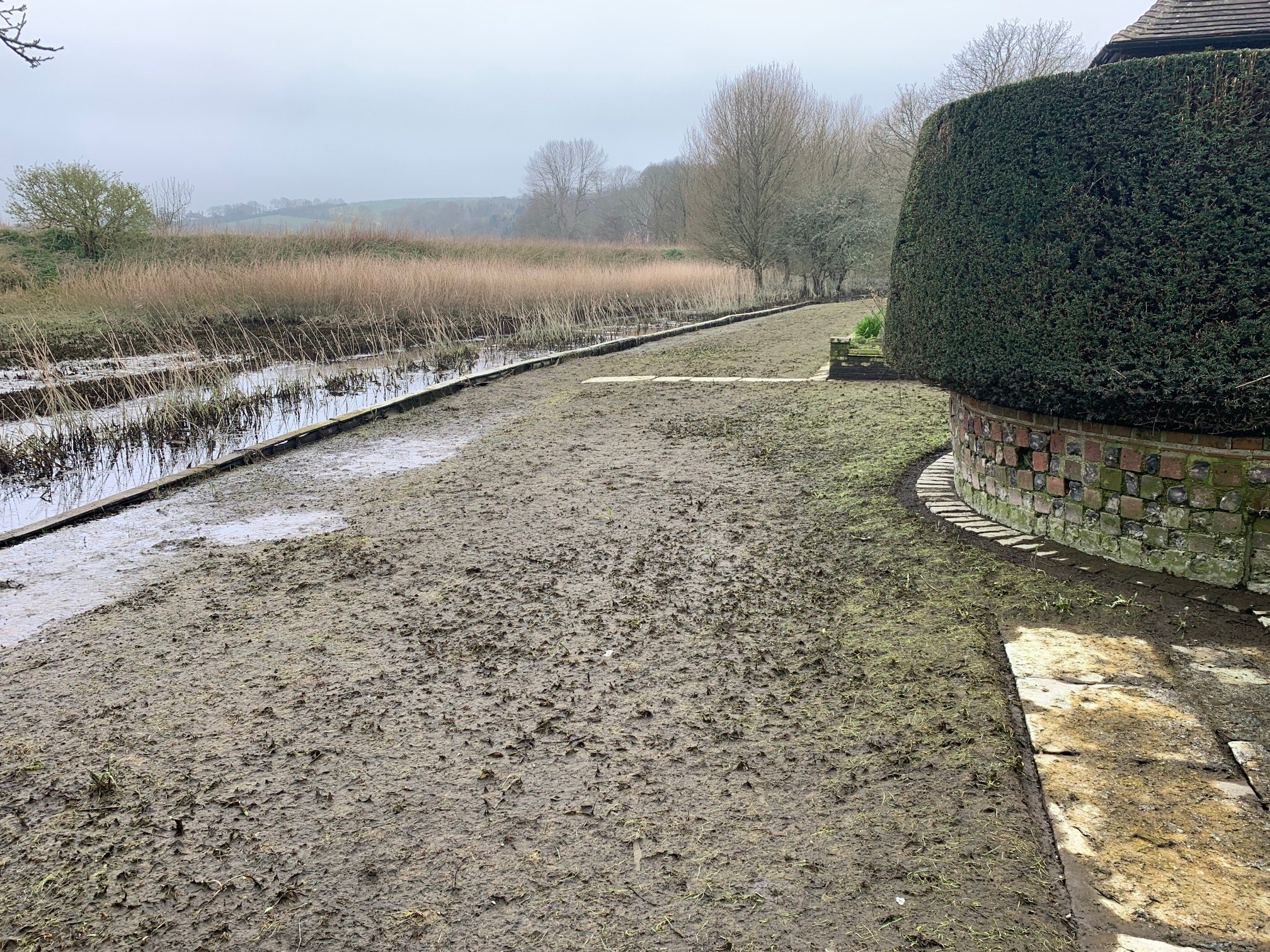 Restricted access and waterlogging in parts of the garden at Alfriston Clergy House in East Sussex