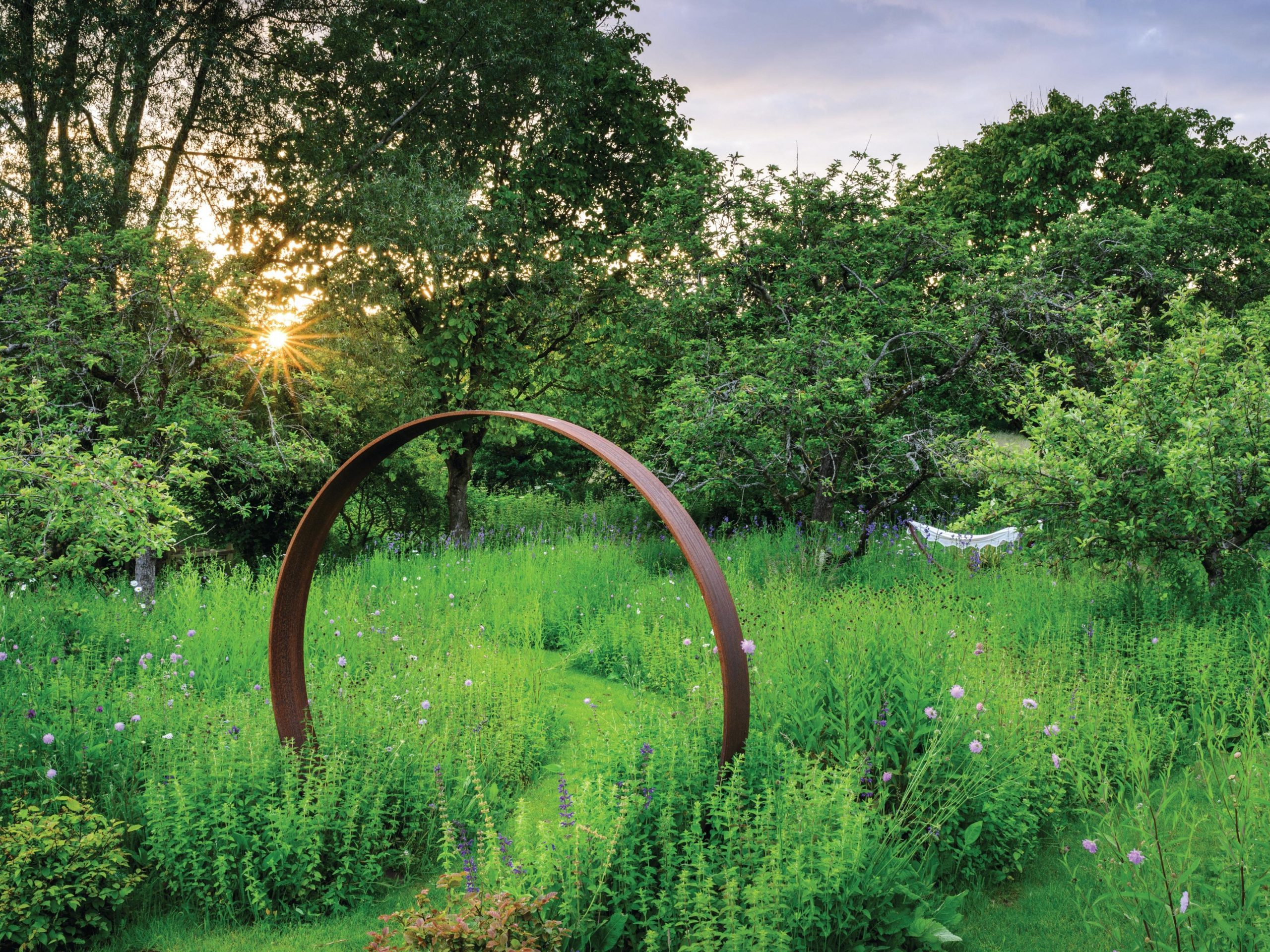 Meadow and metal steel sculpture