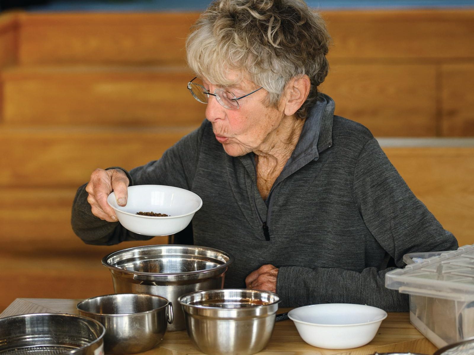 Woman blowing on seeds
