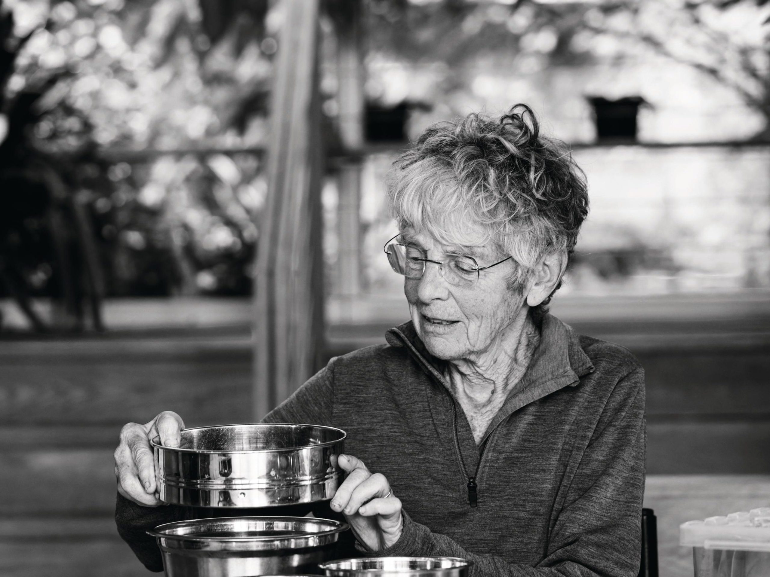 Woman sorting seeds at table