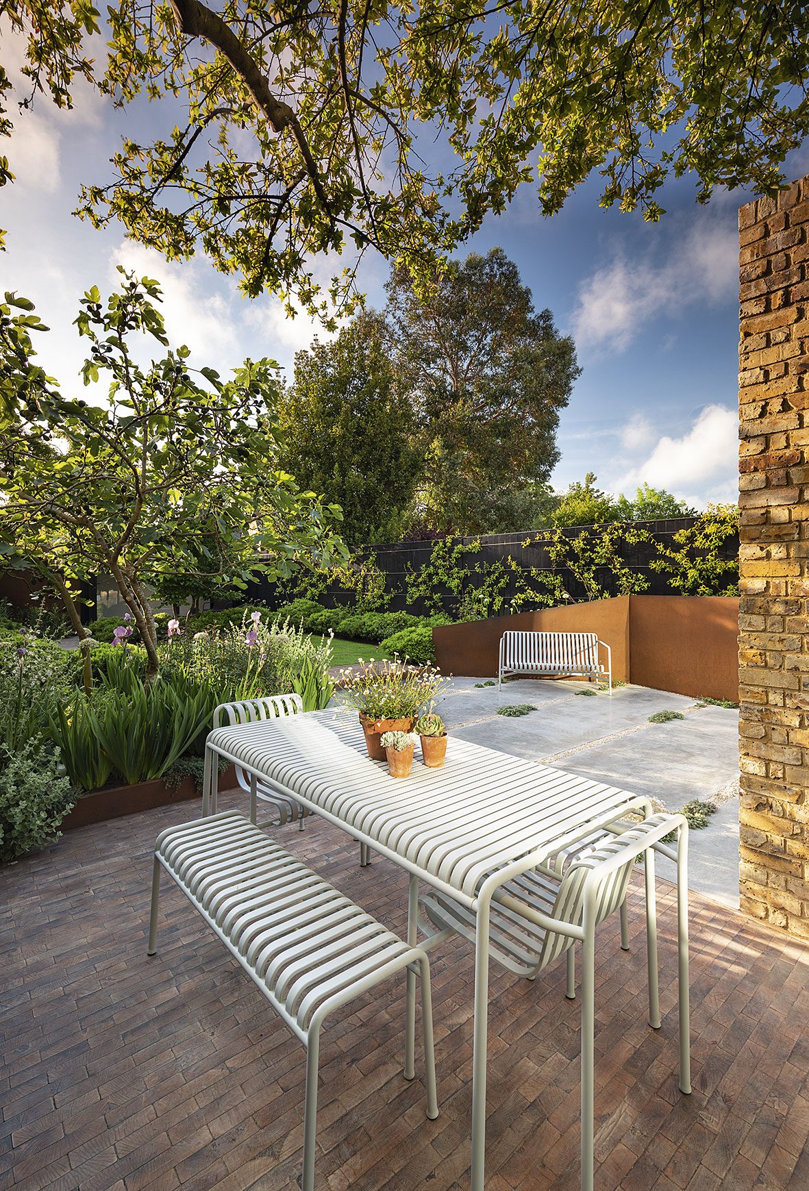 The powder-coated steel furniture is all from the Palissade range designed for Hay.