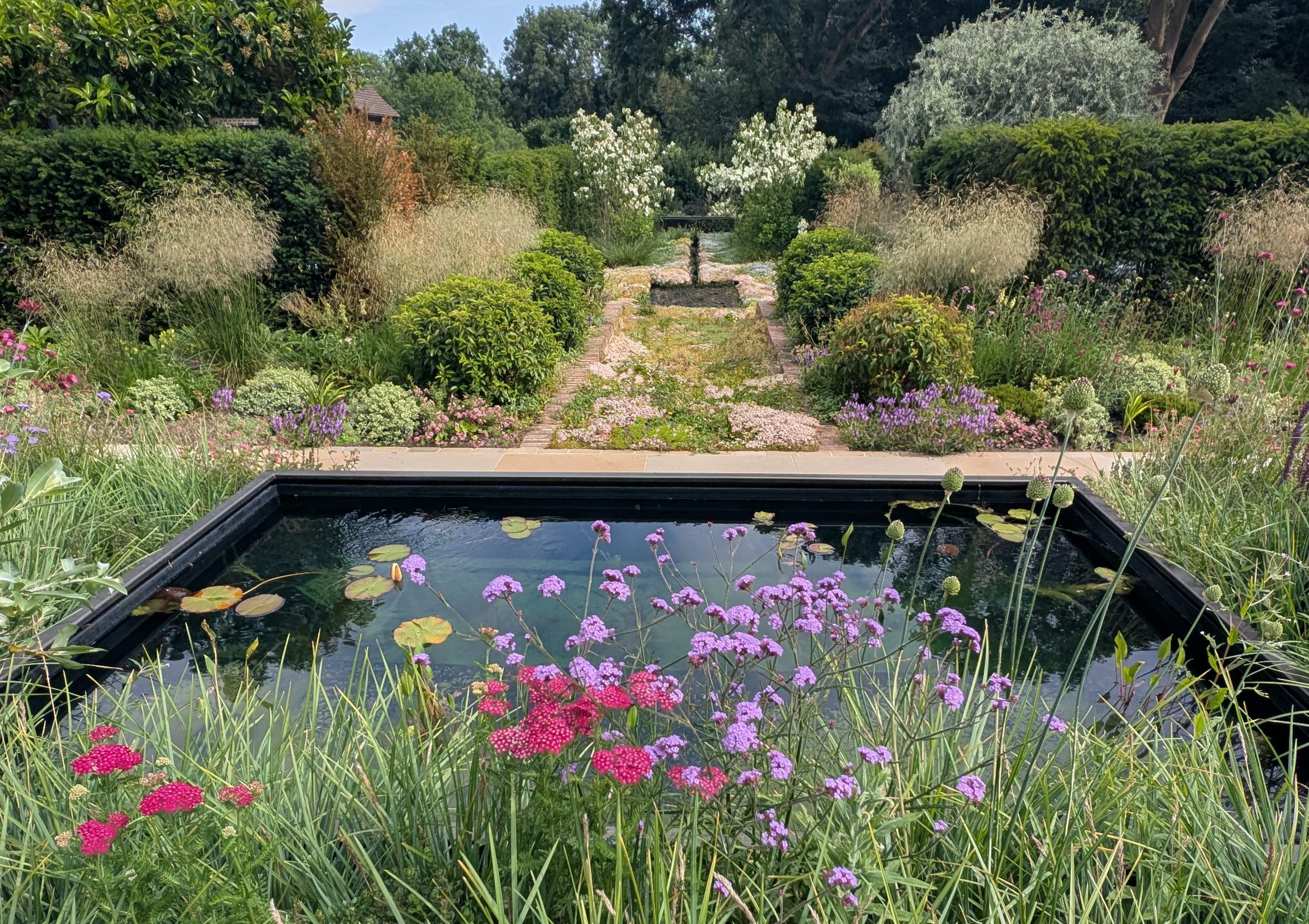 Diverse habitats attract wildlife in this garden in London by Marcus Gilbert Studio.