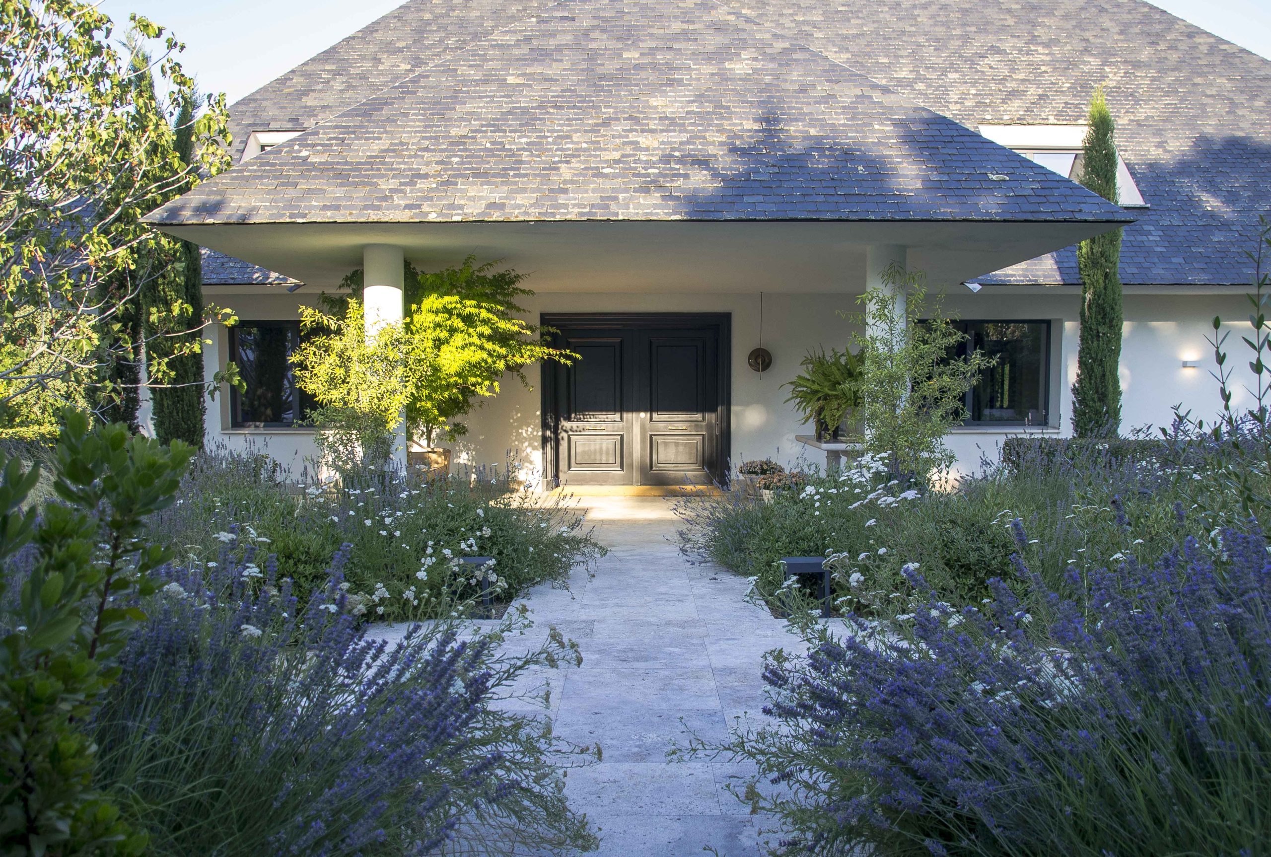 In this garden by Locus Landscape, pathways line up with entranceways to the house for a seamless transition.