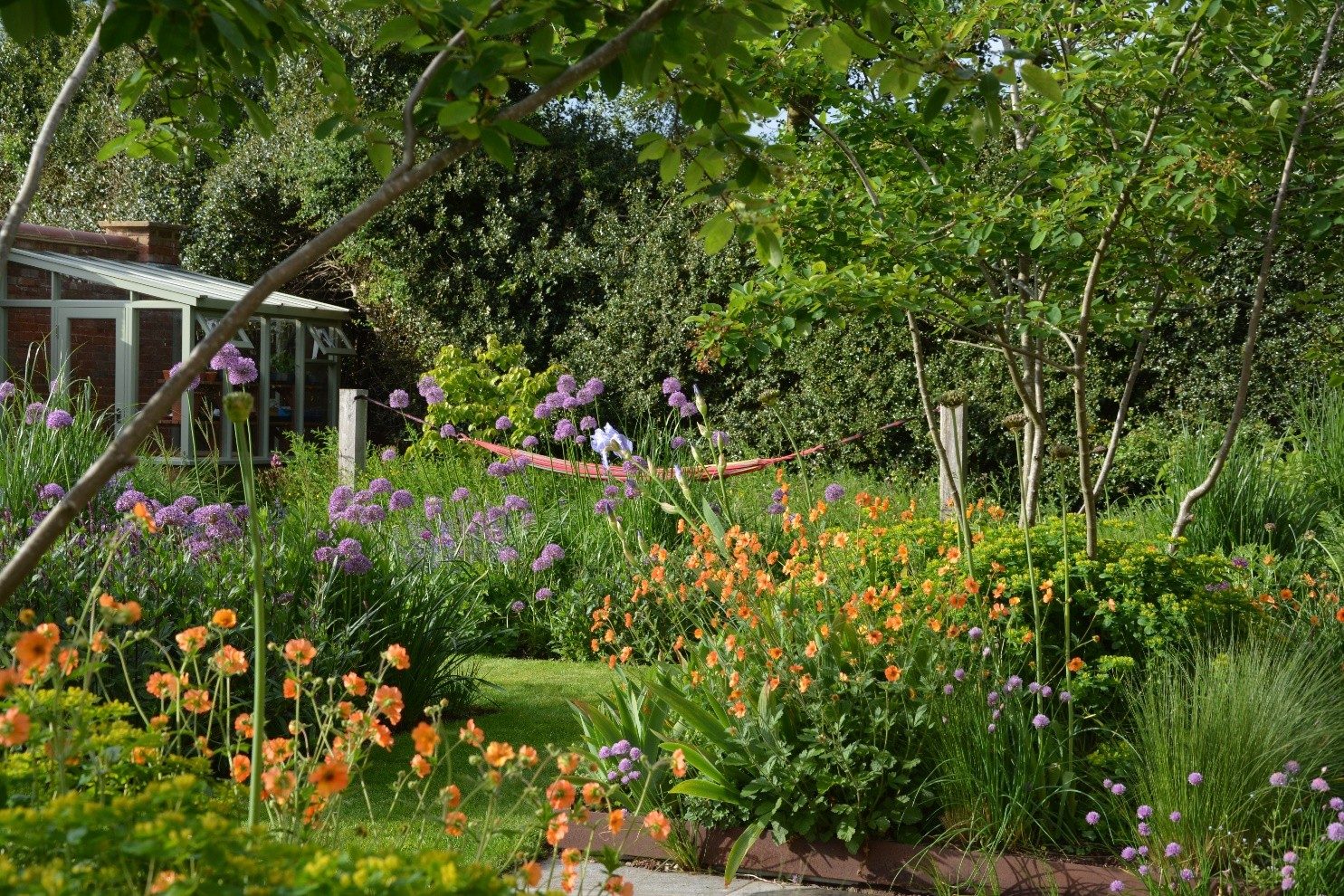 Planting and hard landscaping in a garden designed by The Garden Co.