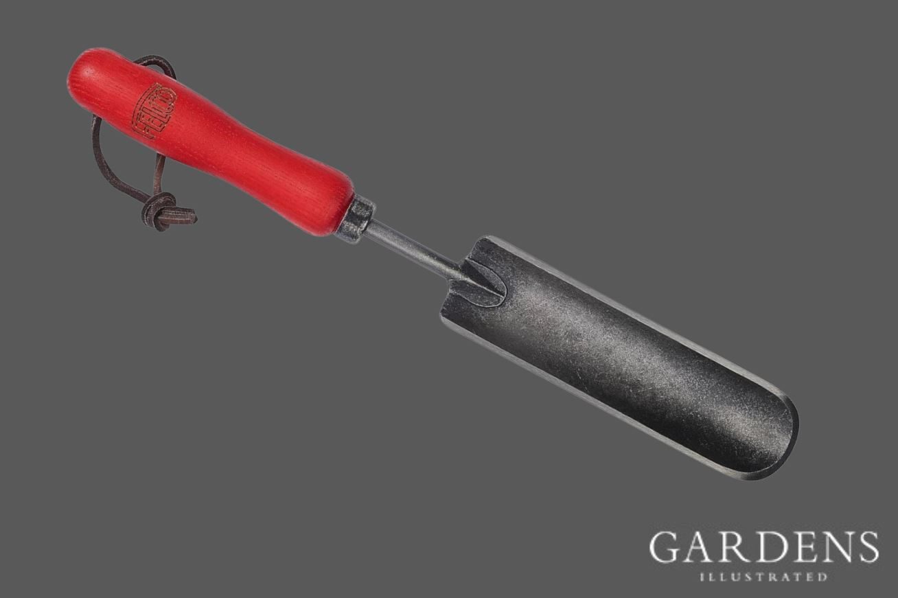 Felco Swiss Hori Hori Tool on a grey background