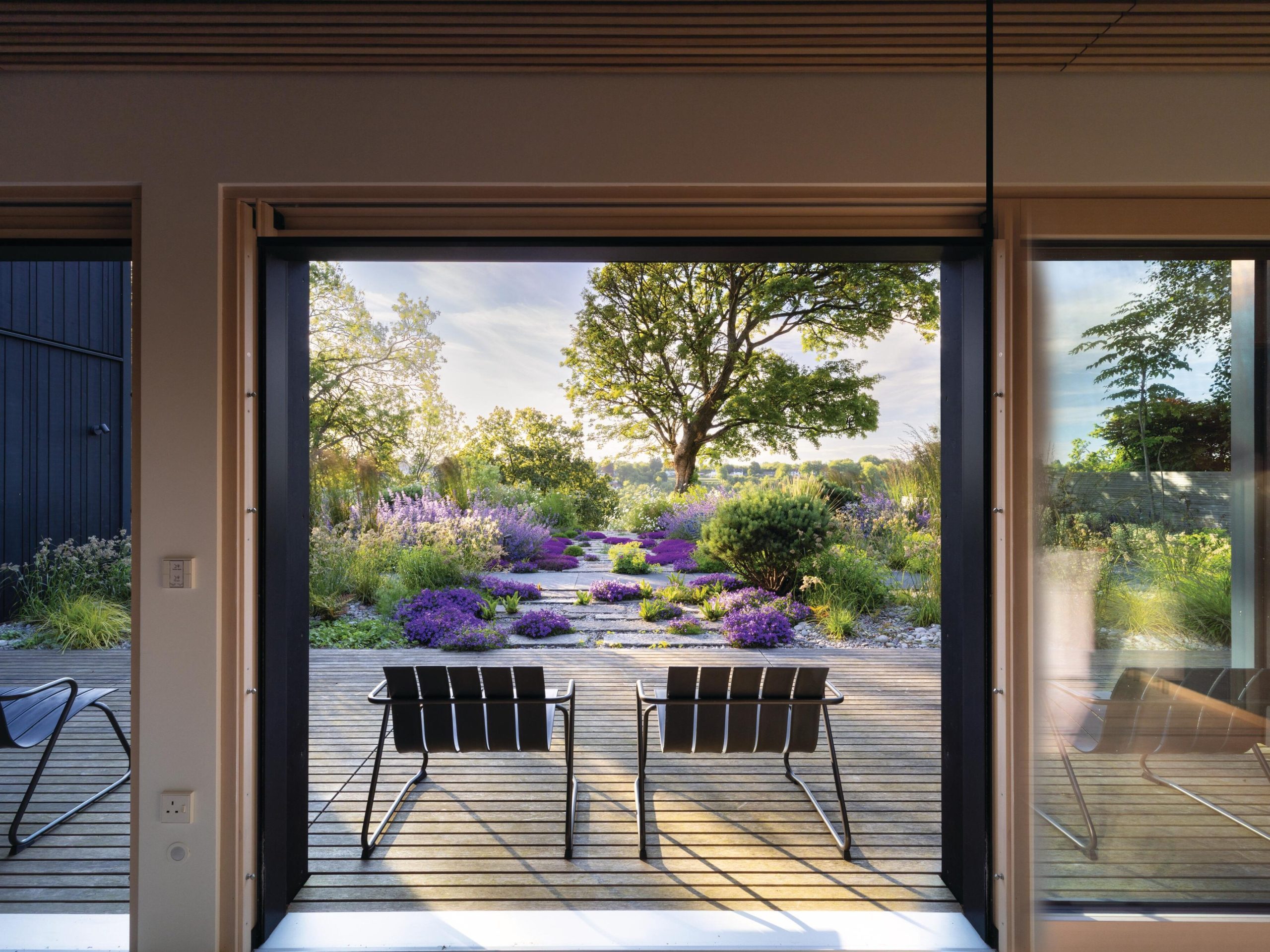 House and garden with chairs