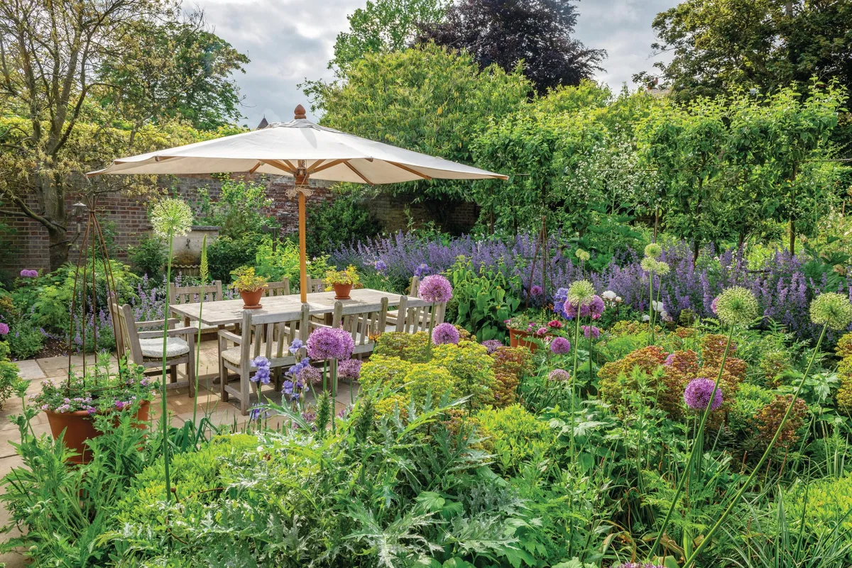 Graham Lloyd Brunt garden Garden seating surrounded by plants