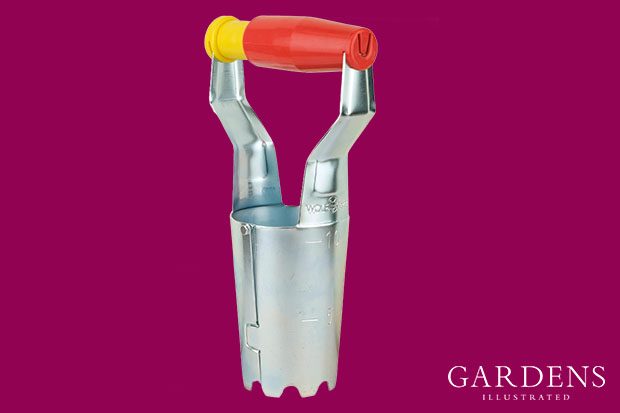 WOLF-Garten Bulb Planter Fixed Hand Tool on a pink background
